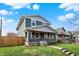 Well-kept two-story home with a charming covered porch and landscaped front yard at 827 E Minnesota St, Indianapolis, IN 46203