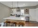 Bright kitchen boasts stainless appliances, center island with breakfast bar, and modern lighting at 827 E Minnesota St, Indianapolis, IN 46203