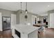 Spacious kitchen with stainless steel appliances, a center island, and dining area at 827 E Minnesota St, Indianapolis, IN 46203