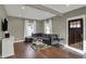 Cozy living room featuring a comfortable gray sectional and hardwood floors at 827 E Minnesota St, Indianapolis, IN 46203