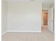 Bedroom featuring neutral walls and carpet, and a doorway leading to another room at 8404 Alcona Dr, Indianapolis, IN 46237
