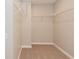 Walk-in closet with neutral carpet and wire shelving at 8404 Alcona Dr, Indianapolis, IN 46237