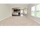 Open-concept view of the living room flowing into the kitchen with modern appliances and dark cabinetry at 8404 Alcona Dr, Indianapolis, IN 46237