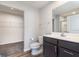 Well-lit bathroom featuring a modern vanity with storage and a walk in closet at 846 Sunchaser Rd, Lebanon, IN 46052