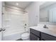 A bathroom featuring a shower-tub combo, white vanity, and modern fixtures at 846 Sunchaser Rd, Lebanon, IN 46052