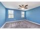 Cozy bedroom features a ceiling fan and two windows at 846 Sunchaser Rd, Lebanon, IN 46052