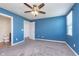 Cozy bedroom with ceiling fan and open doorway to bathroom at 846 Sunchaser Rd, Lebanon, IN 46052