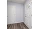 Bright foyer with modern plank flooring, a front door with glass insert, and white trim at 846 Sunchaser Rd, Lebanon, IN 46052