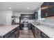 Modern kitchen with stainless steel appliances, granite countertops and dark cabinets at 846 Sunchaser Rd, Lebanon, IN 46052