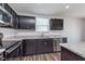 Close-up of the kitchen with granite countertops and stainless steel appliances at 846 Sunchaser Rd, Lebanon, IN 46052