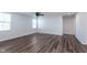 Inviting living space featuring luxury vinyl plank flooring, neutral walls, modern ceiling fan, and large windows at 846 Sunchaser Rd, Lebanon, IN 46052