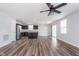 Modern open-concept design with kitchen island, stainless appliances, and LVP flooring throughout living space at 846 Sunchaser Rd, Lebanon, IN 46052