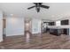 Spacious living area with kitchen island, stainless appliances, LVP flooring, and neutral wall colors at 846 Sunchaser Rd, Lebanon, IN 46052