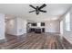 Beautiful open-concept home featuring kitchen island, LVP flooring, stainless appliances, and modern ceiling fan at 846 Sunchaser Rd, Lebanon, IN 46052