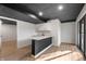 Finished basement with a wet bar featuring modern cabinets, sleek countertops, and a stylish bar area at 9111 Sand Key Ln, Indianapolis, IN 46256