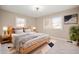 Bedroom featuring a natural wood bed frame and ample natural light at 9111 Sand Key Ln, Indianapolis, IN 46256