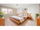 Bright bedroom with a large window, modern lighting, and stylish decor at 9111 Sand Key Ln, Indianapolis, IN 46256