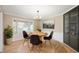 Cozy dining room with bay window and modern chandelier at 9111 Sand Key Ln, Indianapolis, IN 46256