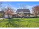 Charming home featuring a large front yard and welcoming curb appeal at 9111 Sand Key Ln, Indianapolis, IN 46256