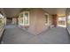 Spacious covered porch featuring a swing, seating, and a charming exterior view at 9111 Sand Key Ln, Indianapolis, IN 46256