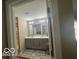 Bathroom featuring a double vanity with gray cabinets and brushed nickel hardware at 9851 Pica Dr, Fishers, IN 46040