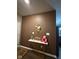 Welcoming entryway with a console table displaying decorative items and a unique wall design at 9851 Pica Dr, Fishers, IN 46040
