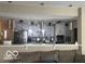 Modern kitchen featuring gray cabinets and stainless steel appliances at 9851 Pica Dr, Fishers, IN 46040