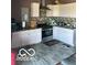Well-lit kitchen featuring modern appliances, sleek countertops, and ample white cabinetry at 9851 Pica Dr, Fishers, IN 46040