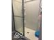 Enclosed shower with white tiles and built-in shelving for bath essentials at 9851 Pica Dr, Fishers, IN 46040