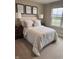 Comfortable bedroom featuring neutral decor, bedside tables, and natural light at 99 Gnarled Oak Ln, Whiteland, IN 46184