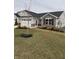 Charming single-story home with a combination of stone and siding and a well-manicured lawn at 99 Gnarled Oak Ln, Whiteland, IN 46184