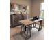 Home office space with a rustic wooden desk, stylish lamps, and a decorative accent cabinet at 99 Gnarled Oak Ln, Whiteland, IN 46184