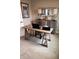 Home office space with a rustic wooden desk, stylish lamps, and a decorative accent cabinet at 99 Gnarled Oak Ln, Whiteland, IN 46184
