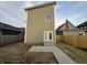 Exterior view of the back of the home with a patio and yard space at 1038 St Peter St, Indianapolis, IN 46203
