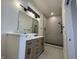 Modern bathroom featuring a double sink vanity and a luxurious tiled walk-in shower at 1038 St Peter St, Indianapolis, IN 46203