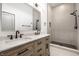 Luxurious bathroom with wood cabinet vanity, double sinks, and a walk-in shower at 1038 St Peter St, Indianapolis, IN 46203