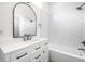 Modern bathroom features subway tile backsplash, a large mirror, and a vanity with storage at 1038 St Peter St, Indianapolis, IN 46203