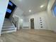 Welcoming entryway with staircase, storage cubbies and a stylish front door at 1038 St Peter St, Indianapolis, IN 46203