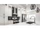 Modern kitchen featuring white cabinetry, sleek countertops, and stylish pendant lighting at 1038 St Peter St, Indianapolis, IN 46203