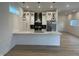Bright kitchen with white cabinets, stainless appliances, and a marble countertop island at 1038 St Peter St, Indianapolis, IN 46203