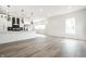Modern kitchen with white cabinets, stainless steel appliances, and open floor plan at 1038 St Peter St, Indianapolis, IN 46203