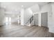Spacious living area featuring wood-look floors and bright white walls for a modern design at 1038 St Peter St, Indianapolis, IN 46203