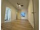 Bright, spacious bedroom featuring a ceiling fan, bathroom, and a view to the exterior at 1038 St Peter St, Indianapolis, IN 46203