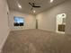Spacious main bedroom featuring neutral carpeting, walk-in closets and ensuite bathroom at 1038 St Peter St, Indianapolis, IN 46203