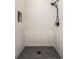 Modern tiled shower features black hardware, a rainfall showerhead, and a built-in niche at 1038 St Peter St, Indianapolis, IN 46203