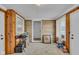 Bonus room featuring tile floors, and stone accent wall, and neutral paint at 1061 N Layman Ave, Indianapolis, IN 46219