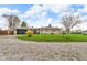 Charming single-story home boasts beautiful stonework, a spacious yard, and an attached garage at 1061 N Layman Ave, Indianapolis, IN 46219