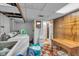 Utility area with washer, dryer, and laundry sink with checkered floors at 1061 N Layman Ave, Indianapolis, IN 46219