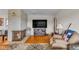 Inviting living room featuring a fireplace, hardwood floors, and a comfortable seating area at 1061 N Layman Ave, Indianapolis, IN 46219