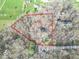 Aerial view of a property with a house nestled among trees and a defined property line at 10614 W Hickory Ct, Quincy, IN 47456